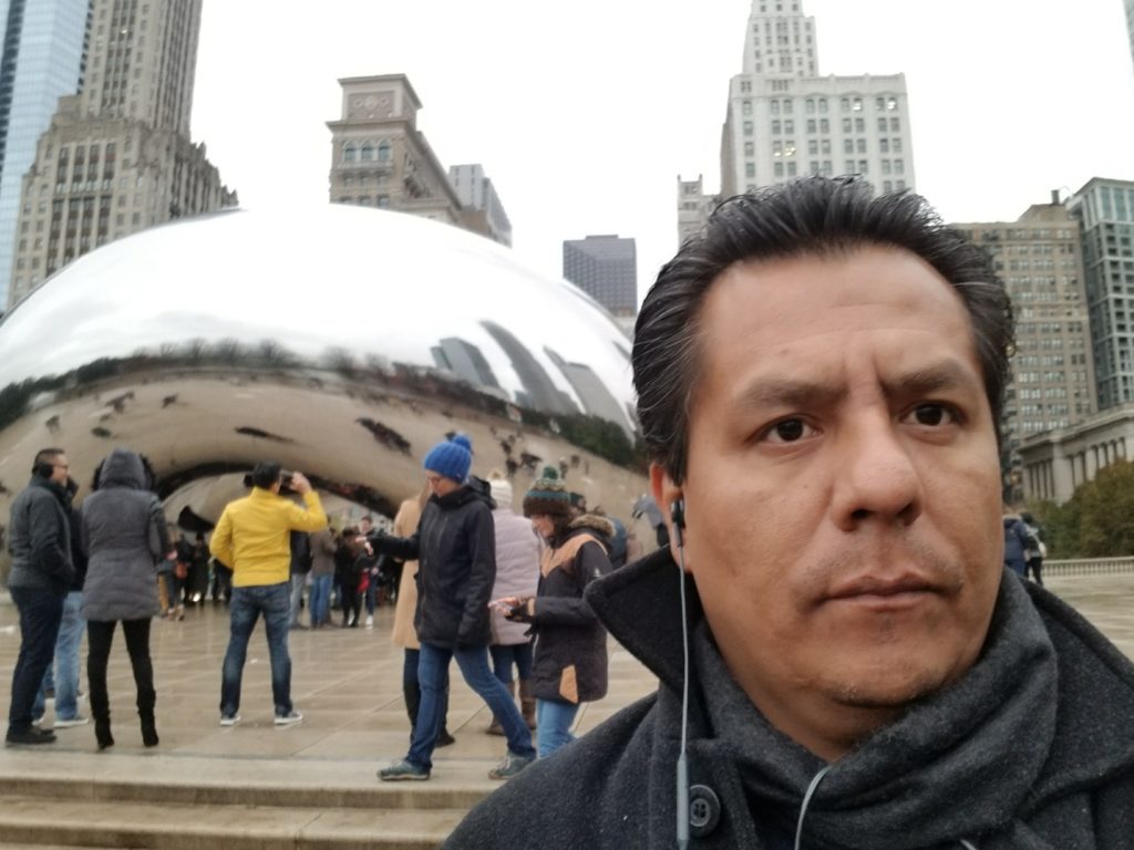 Photo of Juan Carlos Garcia in front of the Bean in Chicago, Illinois