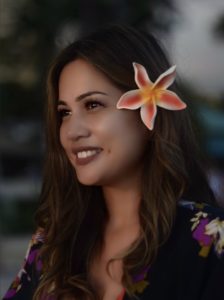 photo of Jeanette with a flower in her hair