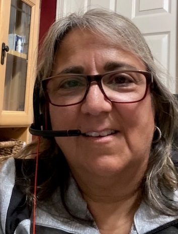 Photo of Annette Marquez wearing a headset